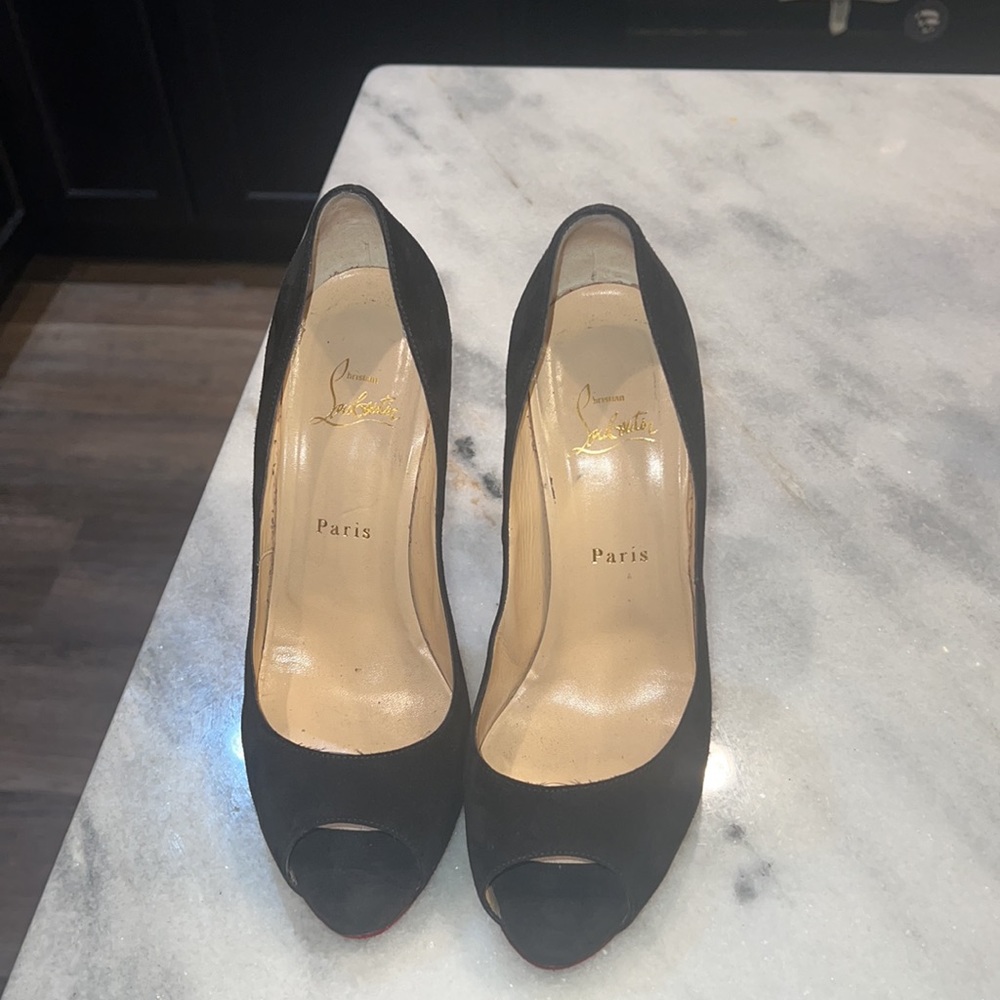 CHRISTIAN LOUBOUTIN black suede peep toe heels with low platform.